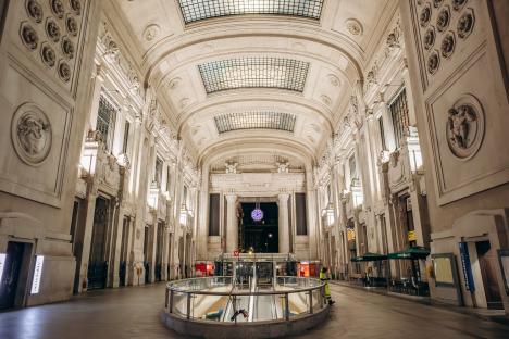 Milano Centrale train station hall at night.