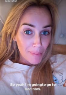 Close-up selfie of Laura Anderson in bed.