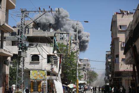 Smoke rises from a building after an Israeli airstrike in Bureij Refugee Camp, Gaza.