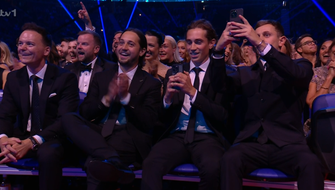 Audience members reacting during an awards show.