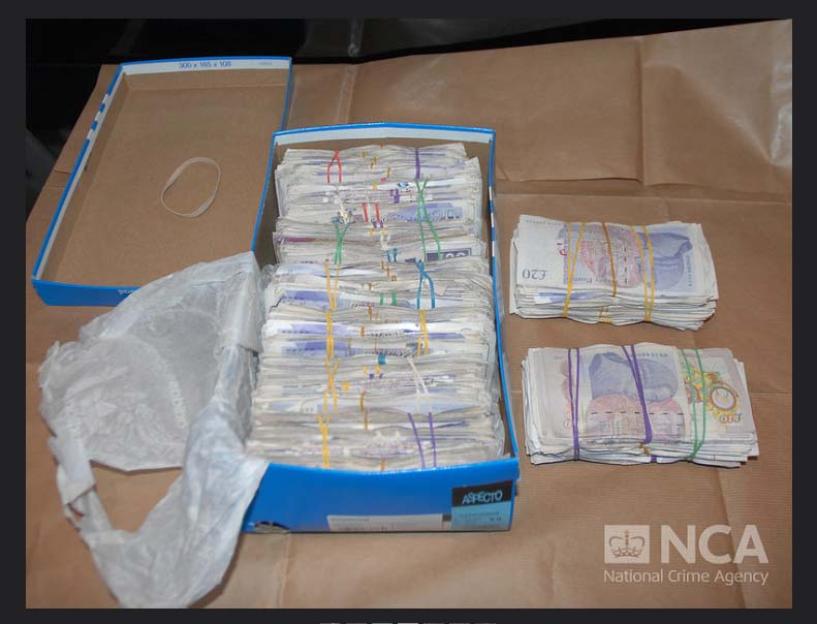 Cash seized from a drug dealer's home.