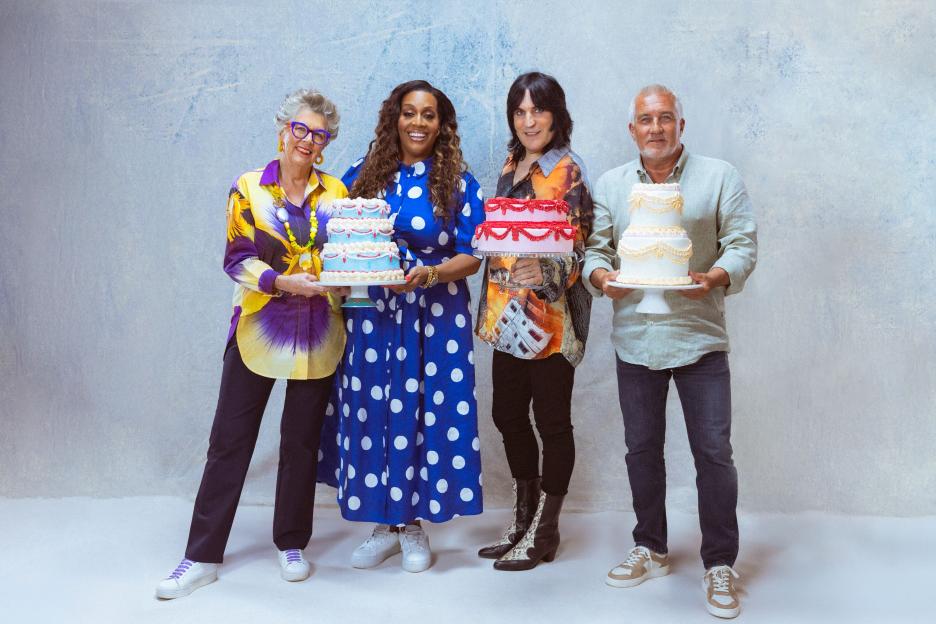 Alison Hammond, Noel Fielding, Prue Leith, and Paul Hollywood holding cakes.