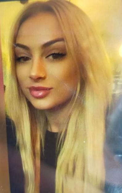 Photo of a young woman with long blonde hair.