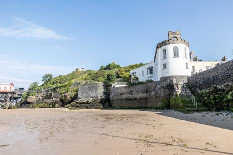 The Cabin, Tenby, on a sandy beach.