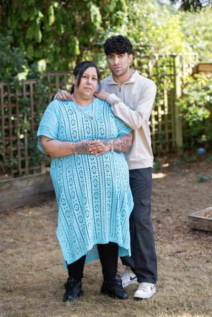 Correne Dadd with her son Josh, standing outdoors with her son's arm around her.