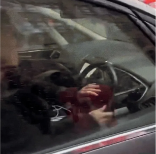 Person driving a car.