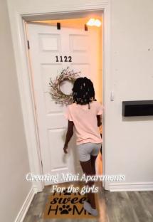Girl walking into a mini apartment in her home.