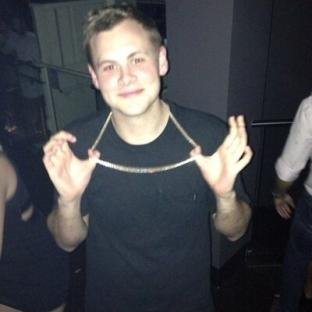 Man wearing a gold chain.