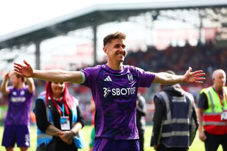 Tom Cairney of Fulham celebrates after a football match.