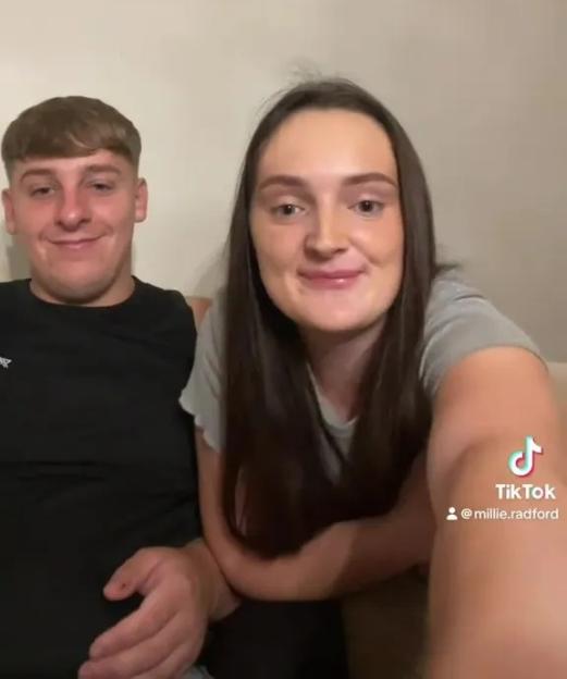 Millie Radford and a man announcing a new addition to their family.