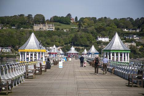 People walking on Bangor Pier in Wales.