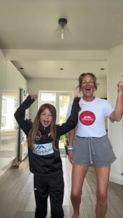 A woman and a girl celebrating.