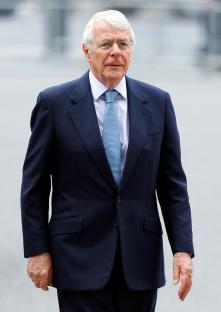 Sir John Major at a memorial service.