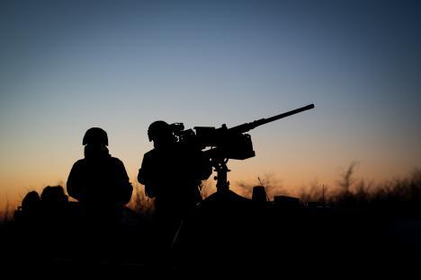 Ukrainian soldier firing a BM-21 Grad multiple-launch rocket system.