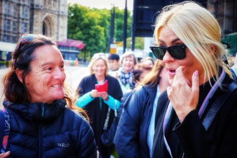 Holly Willoughby and another woman talking outside St James's Palace.