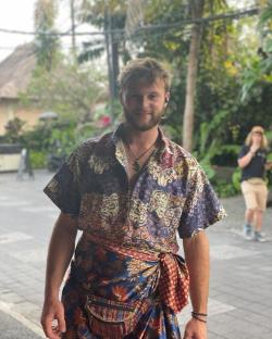 Sam Gardiner, Race Across the World contestant, wearing a patterned shirt and sarong.