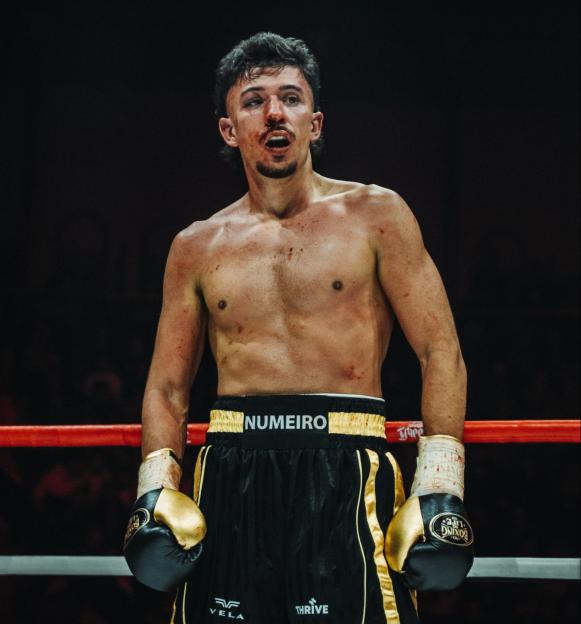 Bloody boxer in the ring.