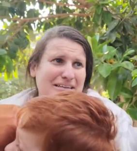 Screengrab from a Hamas video showing a mother and her two sons being kidnapped.