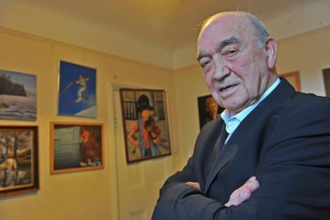 Eddie Richardson, a former gang boss, in a room with his paintings.