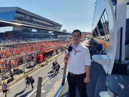 Reporter at a Formula 1 race.