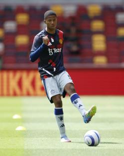 Manchester United's Chido Obi warming up before a soccer match.