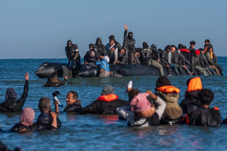 Migrants in a small boat crossing the English Channel.