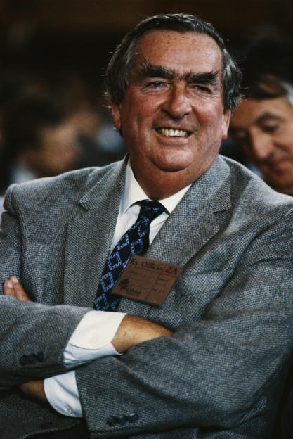 British Labour politician Denis Healey smiling at the annual party conference.