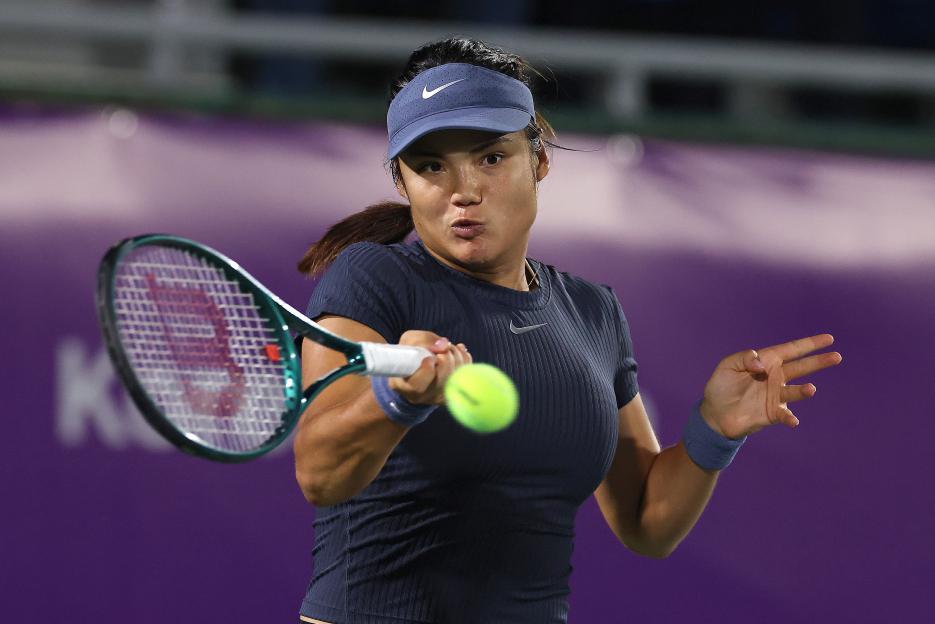 Emma Raducanu of Great Britain returns a shot.