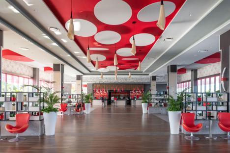Hotel lobby with red and white decor.