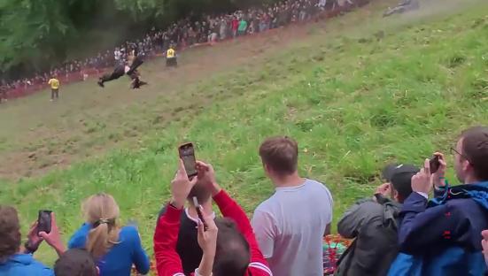 Daredevil dressed as wizard ‘lucky to be alive’ after SOMERSAULTING down hill as he warns cheese chasing is ‘dangerous’