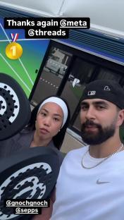 Lochan Nowacki and a woman holding paddle rackets.