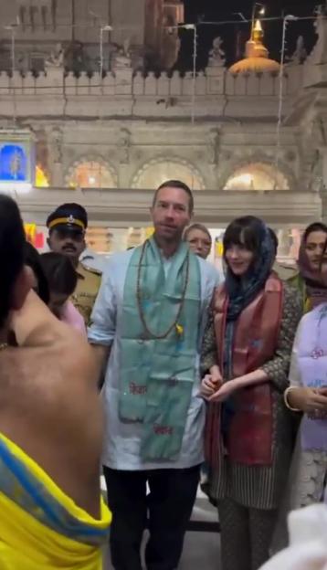 Chris Martin and Dakota Johnson at a temple in Mumbai.