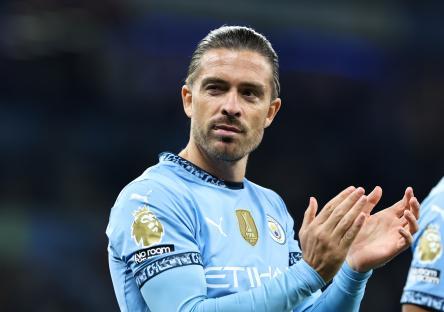 Jack Grealish of Manchester City applauding fans.