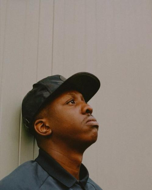 Portrait of a man wearing a baseball cap.