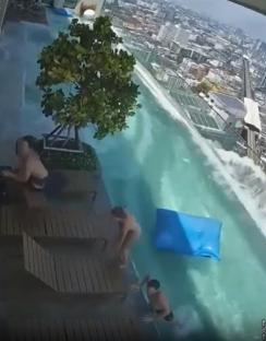 People scrambling to safety as a rooftop pool overflows during an earthquake.