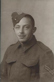 Black and white photo of a young man in a military uniform.