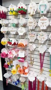 Display of summer-themed jewelry and hair accessories.