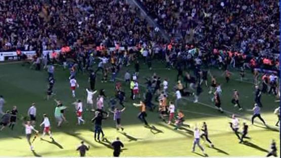 Bradford clash SUSPENDED with club seconds from promotion as fans storm pitch BEFORE full-time