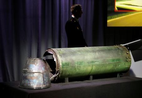 Damaged missile displayed at a news conference.