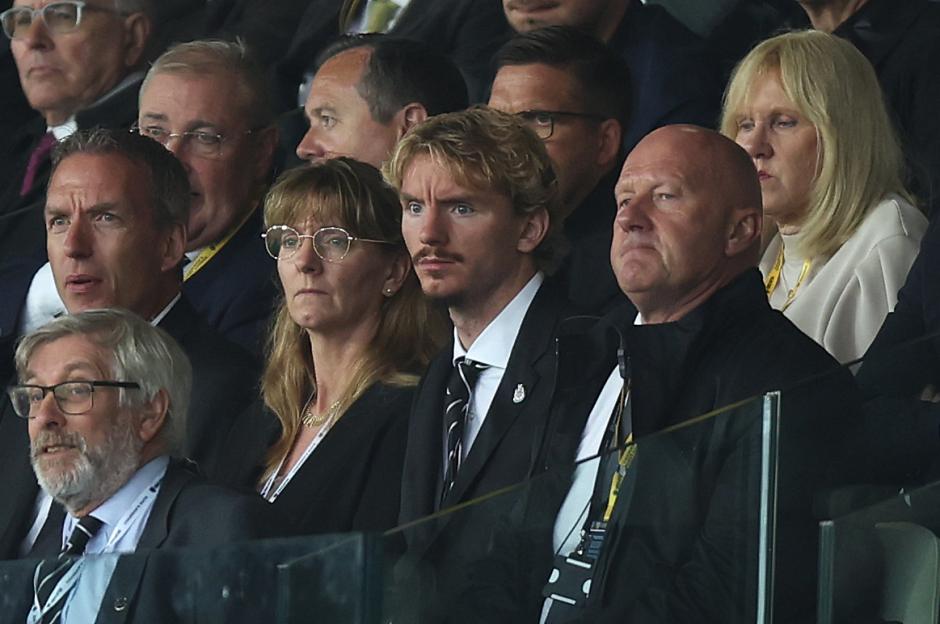 Nick Woltemade, new Newcastle United signing, in the stands at a Premier League match.
