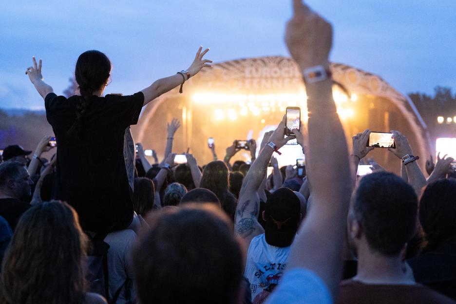 Festival-goers take photographs of the Iron Maiden performance at Eurockéennes de Belfort.
