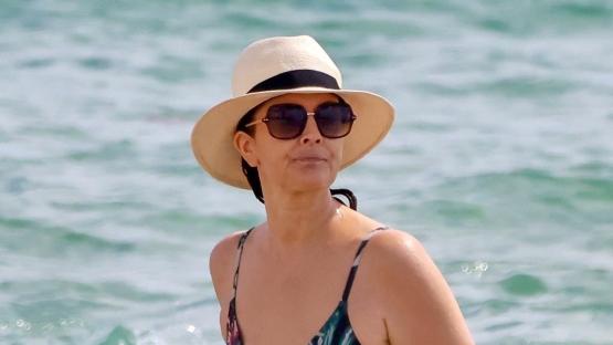 Drew Barrymore, 50, reveals fit figure and rarely-seen lower back tattoo in a floral swimsuit on Miami beach getaway