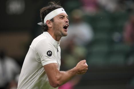 Taylor Fritz reacts during a Wimbledon tennis match.