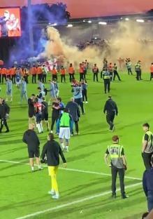 Oldham fans pitch invasion after reaching the playoff final.