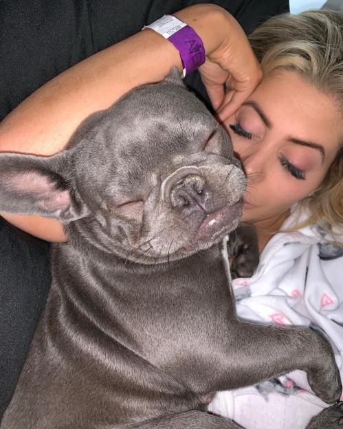 Chloe Ferry sleeping with her dog.
