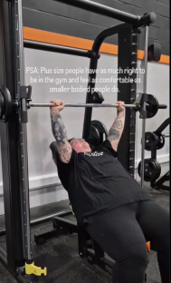 Plus-size person weightlifting at the gym.