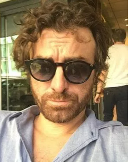 Photo of Diego wearing sunglasses.