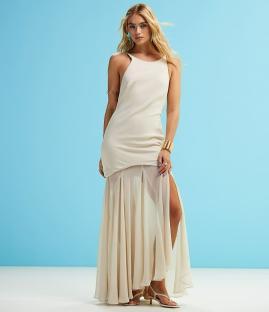 Woman in a beige maxi dress.