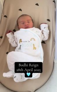 Newborn baby Bodhi Reign sleeping in a bassinet.