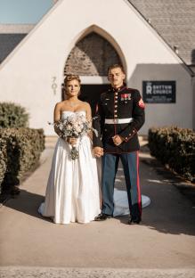 Bride and groom posing for a wedding photo.